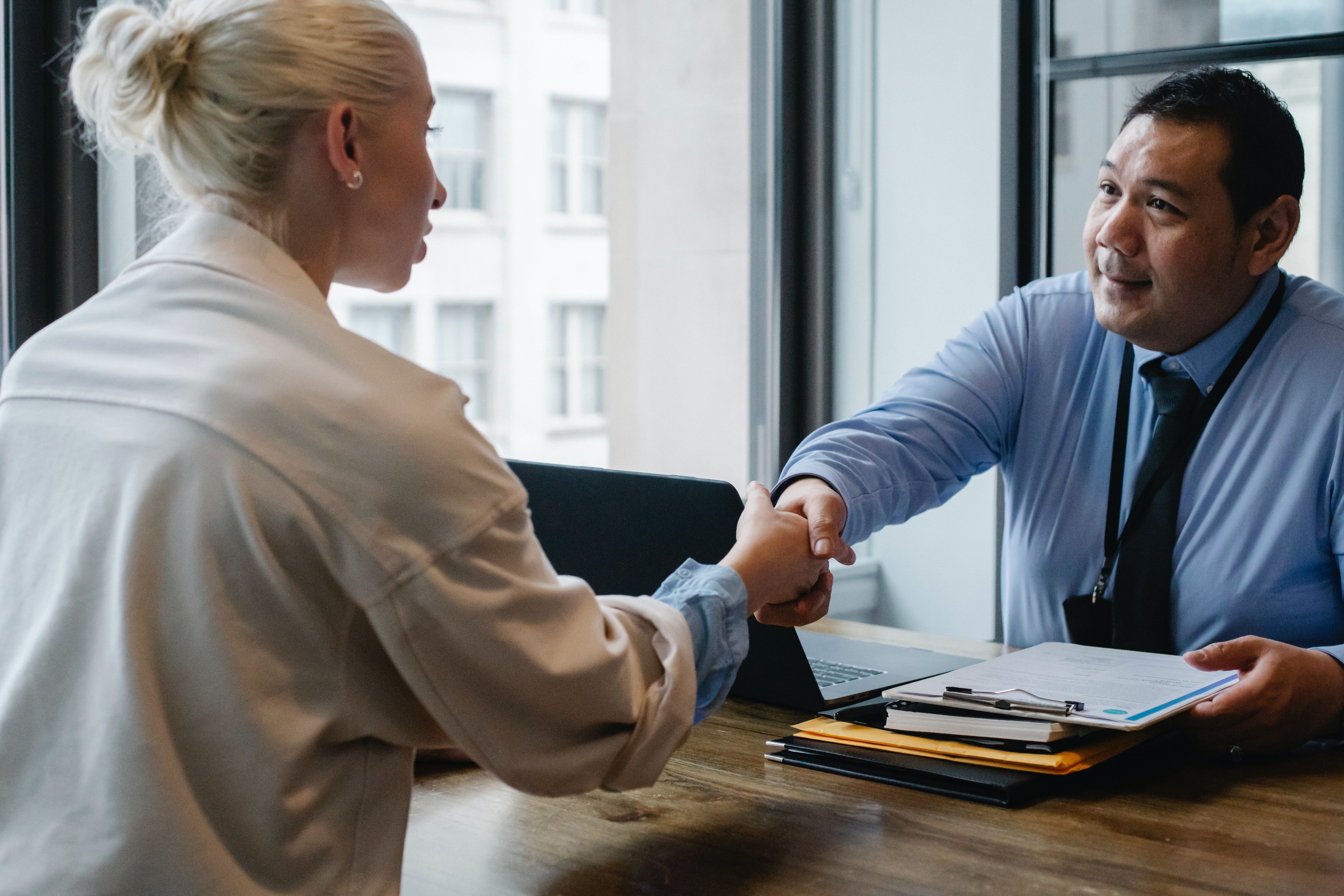 Woman and man handshake