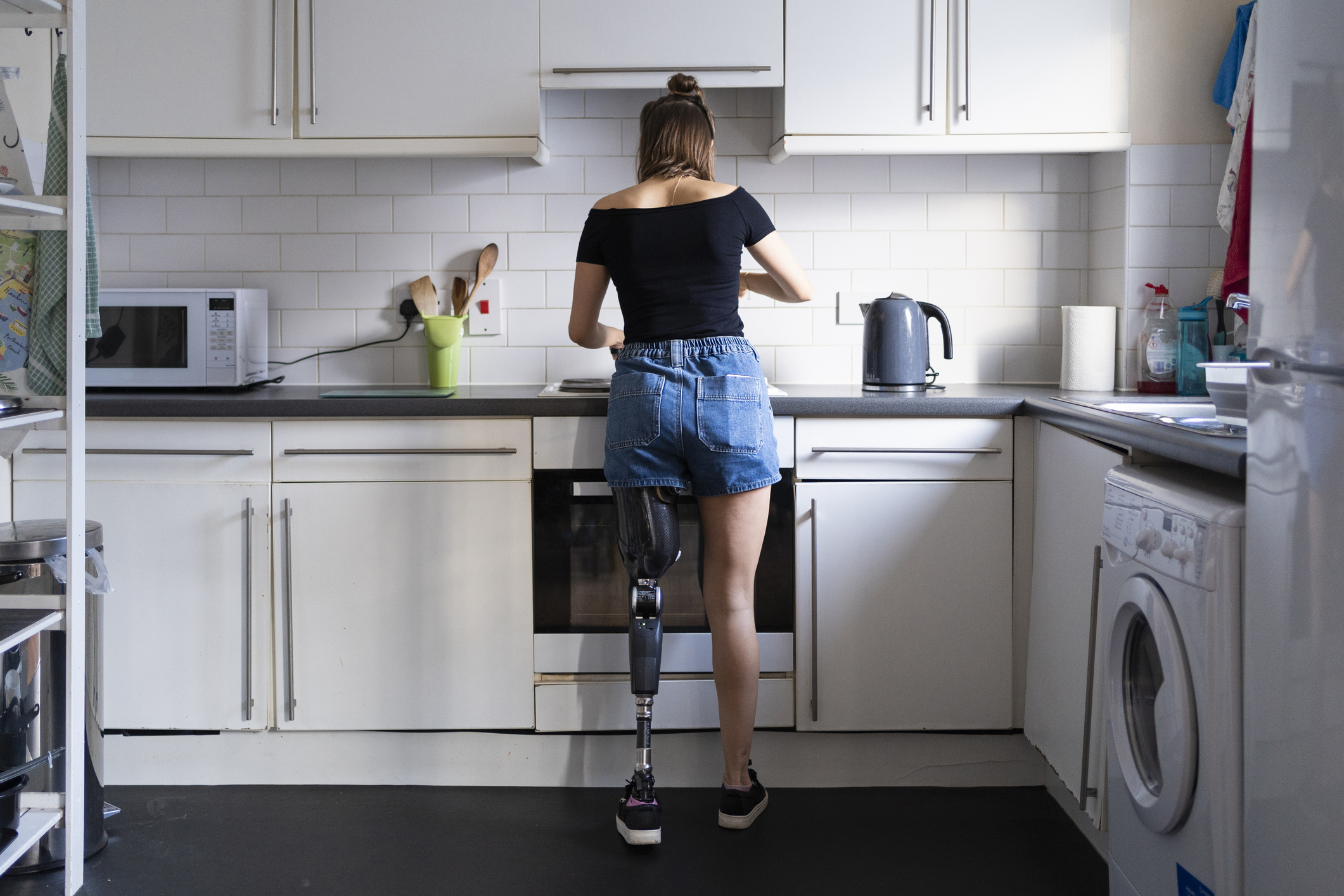 Disabled woman in kitchen