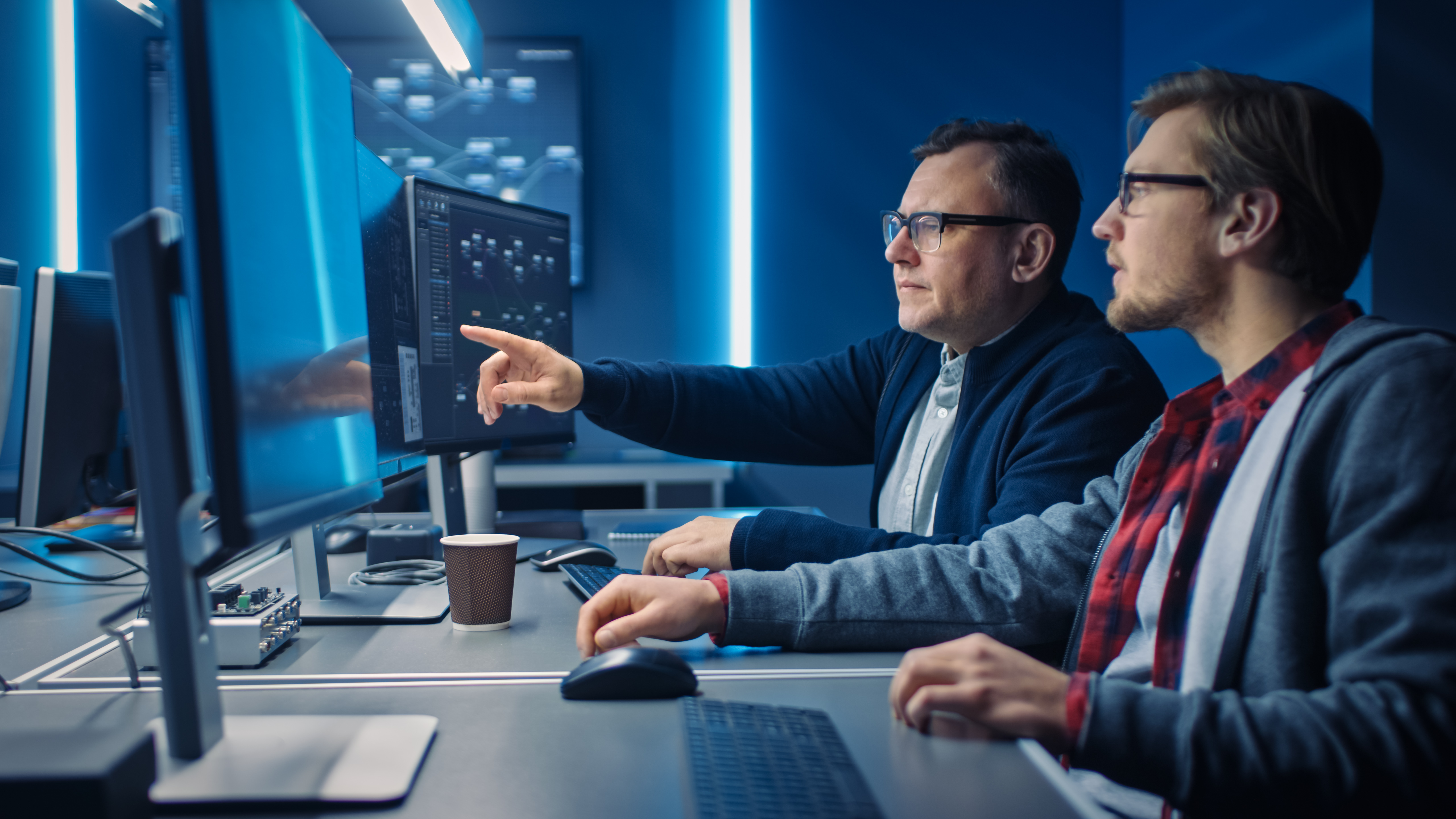 Men working on computer