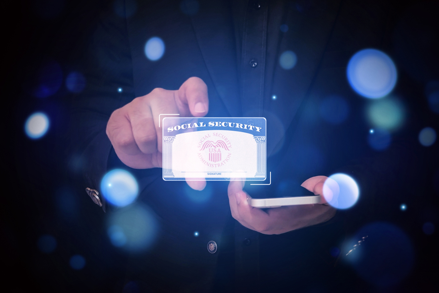 Abstract representation showing someone holding a Social Security card and a mobile phone.