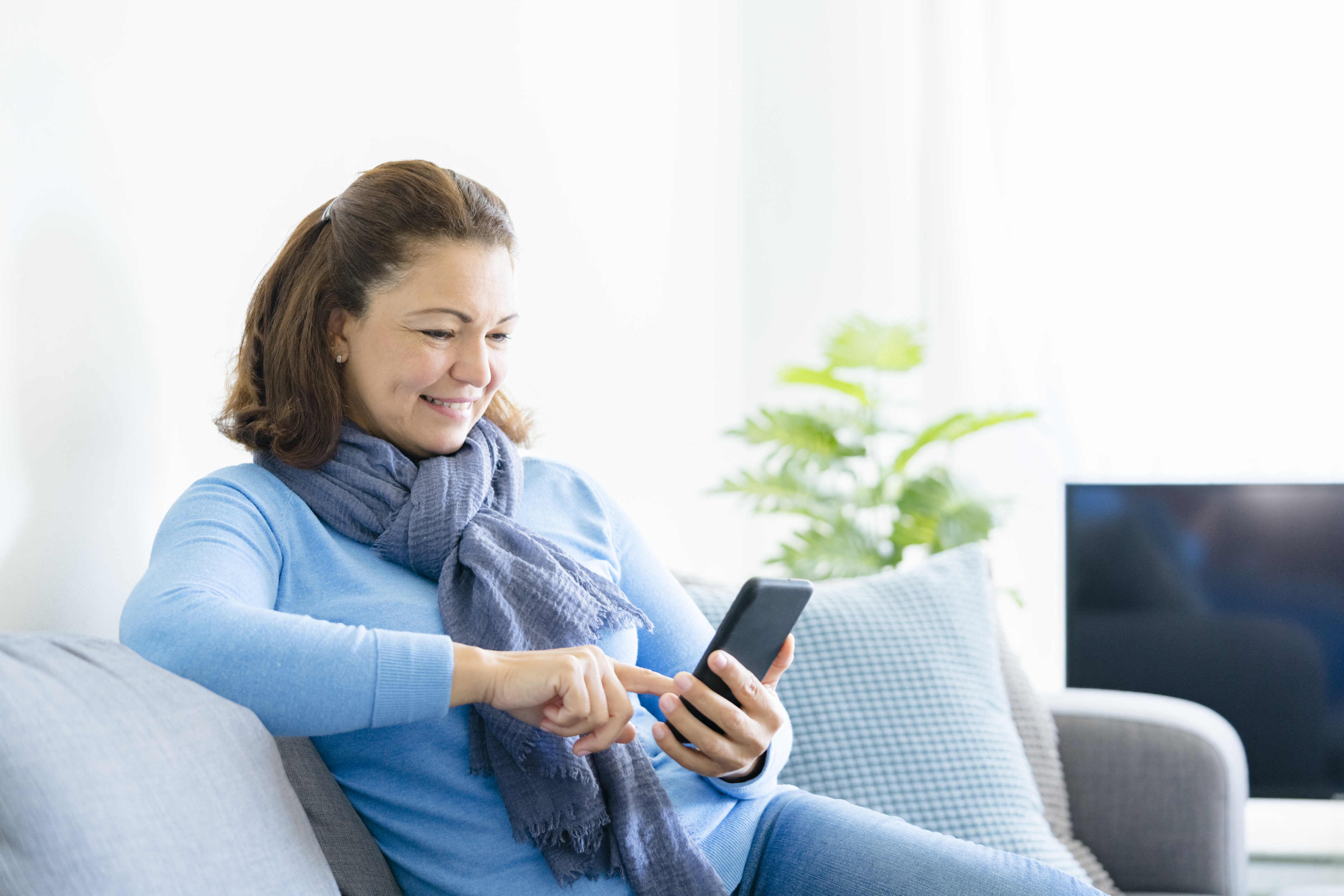 Woman reading on smart phone