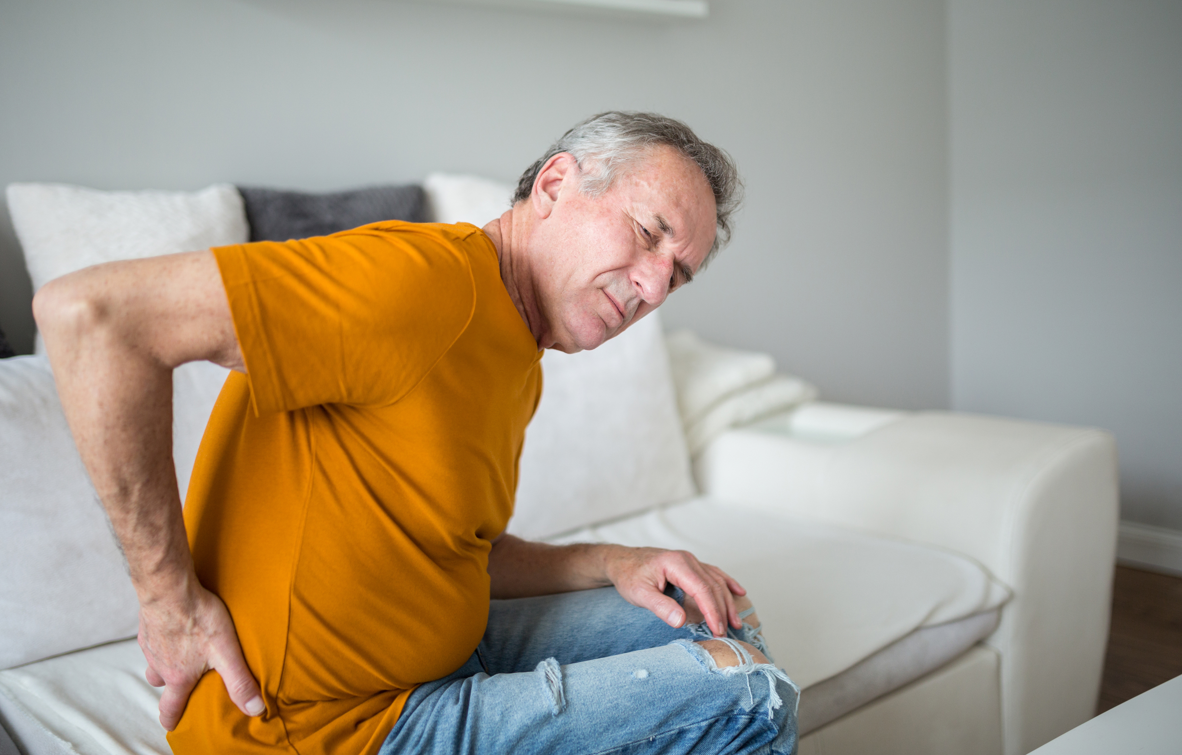 Older man sitting on couch