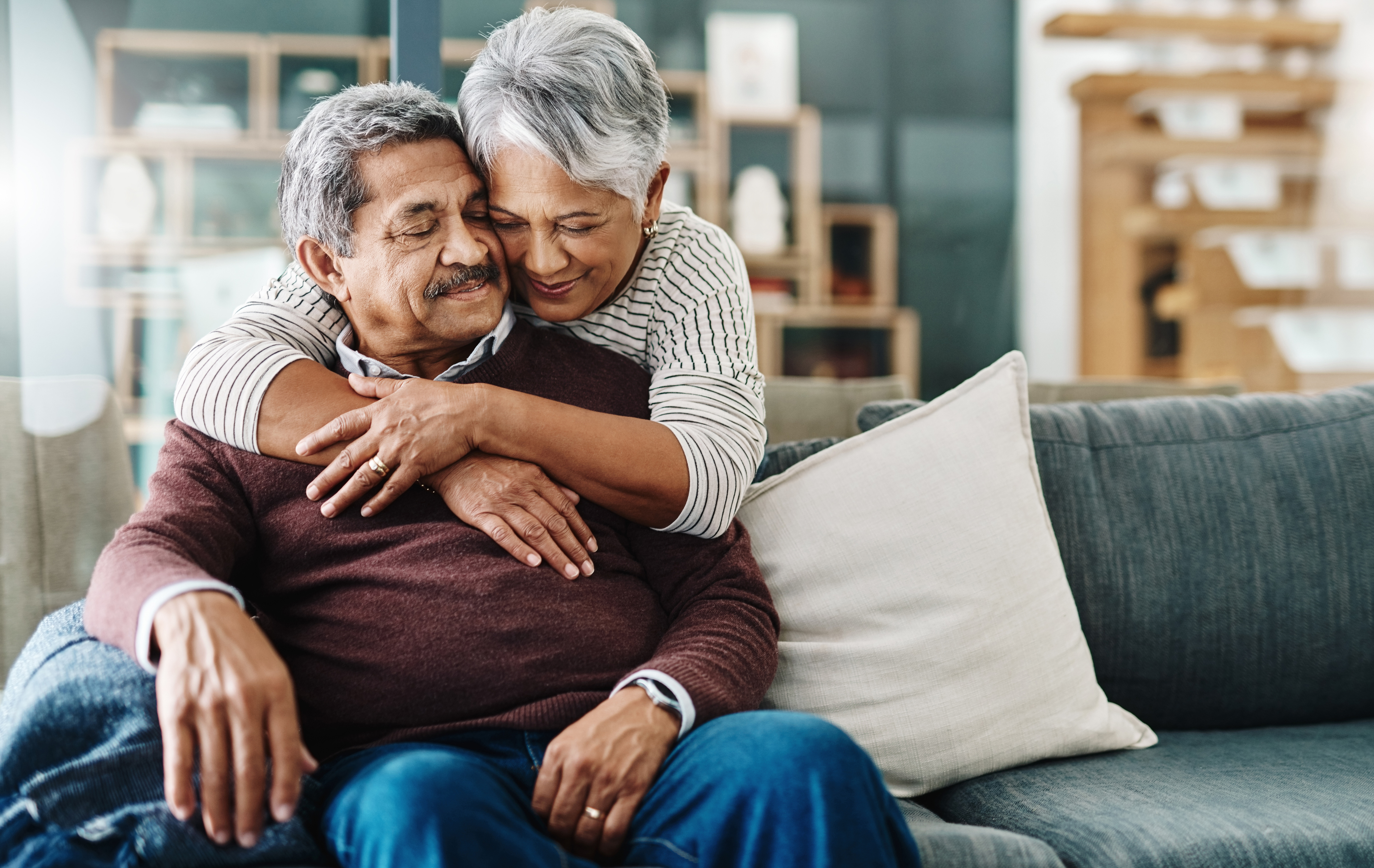 Older husband and wife hugging